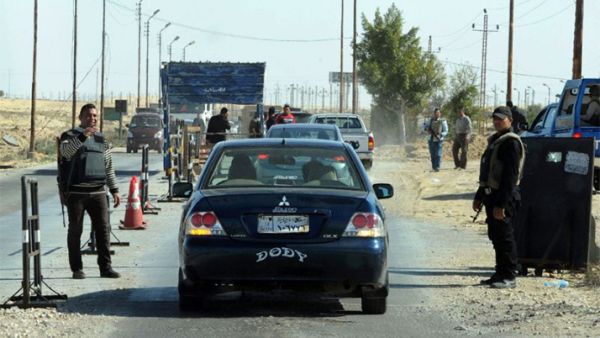 Egyptian police inspect cars at a checkpoint in North Sinai. (AFP)