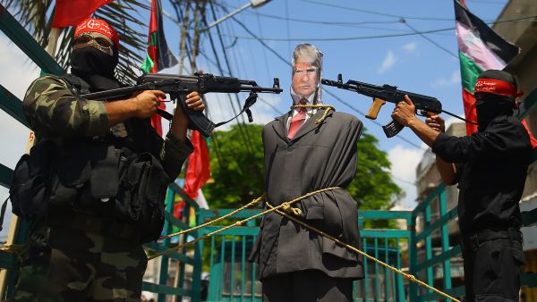 Dozens of supporters crowded at Shuhada Square in the center of the city and torched US flags, as well as photos and an effigy of Donald Trump. (AFP)