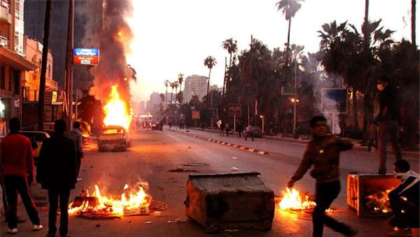 Protesters and riot police clash during 2013 protests in Alexandria. (AFP/File)