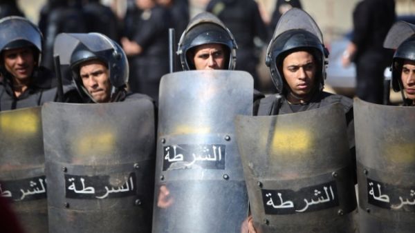 Egyptian police stand in front of the Police Academy. (AFP/File)