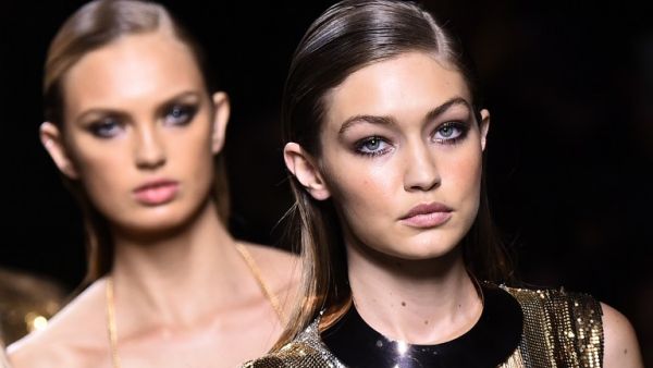 Gigi wore an asymmetric black sequinned gown and high heels as she led the other models to close the show. (AFP/Bertrand Guay)