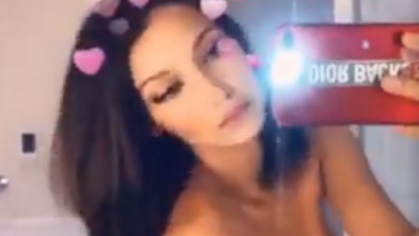 American model Bella Hadid tweeted a topless video of her through the mirror and did not forget to add a hearts filter to it. (source: Twitter - @bellahadid)