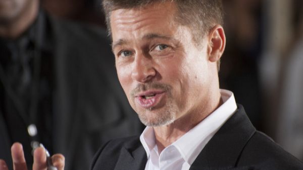 Actor and producer Brad Pitt bid $120,000 to watch an episode of Game of Thrones with Emilia Clarke, who plays Daenerys (Source: Ozgur Guvenc - Shutterstock)