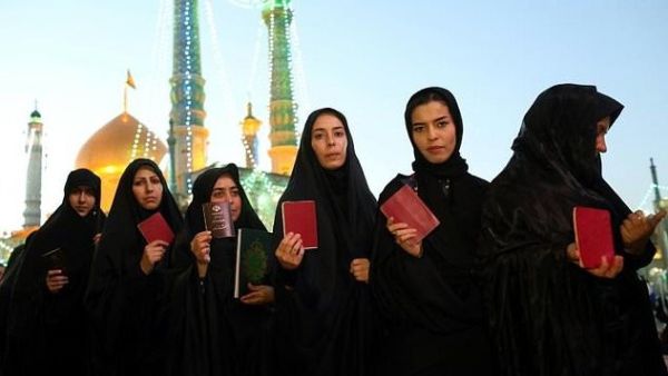 Iranian women are barred from showing their hair—though not everyone's very strict about it. (AFP)