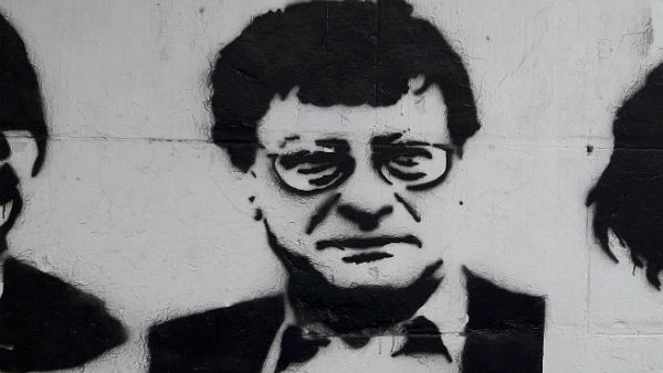 Mahmoud Darwish's likeness spray-painted. (Wikimedia Commons)
