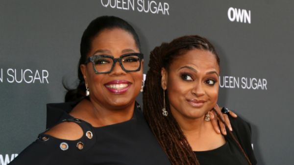 Director Ava DuVernay stands with Oprah Winfrey. (Joe Seer / Shutterstock.com)