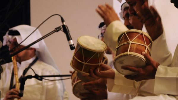 Saudi Arabian men hit the tabla. (Aisyaqilumaranas / Shutterstock.com)