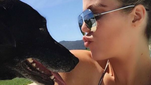 The 'Keeping Up With The Kardashians' star is "devastated" by the passing of her canine friend, a black Labrador called Gabbana (Source: @khloekardashian - Instagram)
