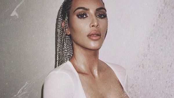Kim shared several sultry looks on Monday including this topless shot regardless of being accused of cultural appropriation (Source: kimkardashian - Twitter)