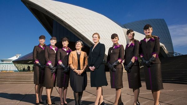 Etihad Airways flight attendants standing in front of the Sydney Opera House. (AFP/File)