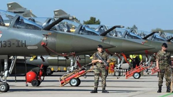 French soldiers are in faction in front of Mirages 2000 jets at the BA 133 air base in Nancy-Ochey, eastern France, on March 25, 2011. (AFP/Frederick Florin)