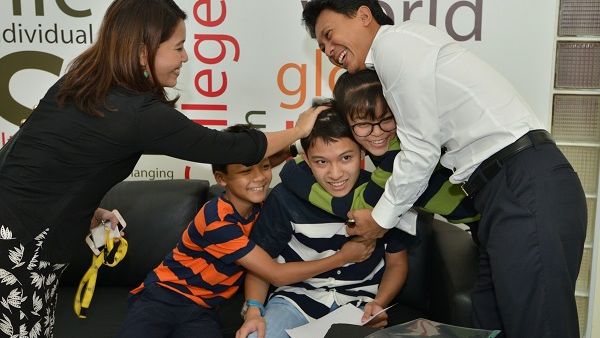 Family celebrating students A level result 