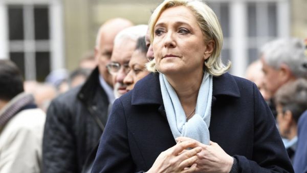 French presidential election candidate for the far-right Front National (FN) party, Marine Le Pen attends a ceremony honouring the policeman killed by a jihadist in an attack on the Champs Elysees, on April 25, 2017 at the Paris prefecture building. (AFP/Bertrand Guay)