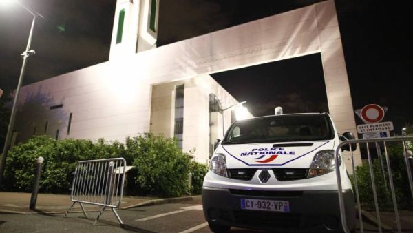 A police vehicle is stationed outside a mosque Thursday in the Paris suburb of Creteil after a man tried to drive a car into a crowd front of the Islamic religious facility. (AFP)
