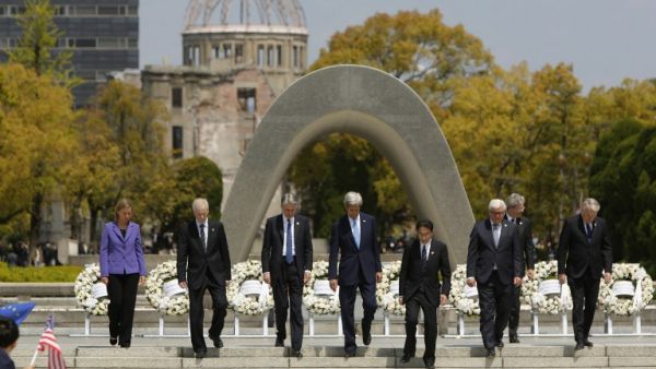 The G7 foreign ministers walk down the steps together after placing wreaths in front of the memorial in Hiroshima, Japan, on April 11, 2016. (AFP/Jonathan Ernst)