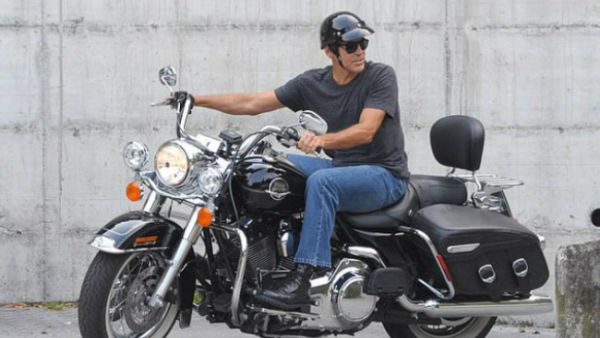 On the go: Amal has reportedly tried to get her husband off of motorcycles for good, after he was hospitalized following a scooter crash in Italy back in July (Source: Picture Perfect - REX - Shutterstock)