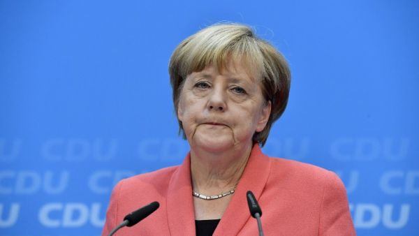 German chancellor Angela Merkel of the Christian Democratic Union (CDU) speaks during a press conference one day after regional election polls in Berlin on September 19, 2016. (AFP/John Macdougall)