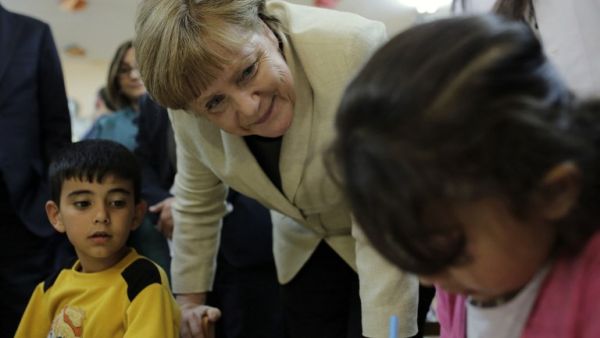 German Chancellor Angela Merkel talks with refugee children at a preschool, during a visit to a refugee camp on April 23, 2016 on the Turkish-Syrian border in Gaziantep. (AFP/Stringer)
