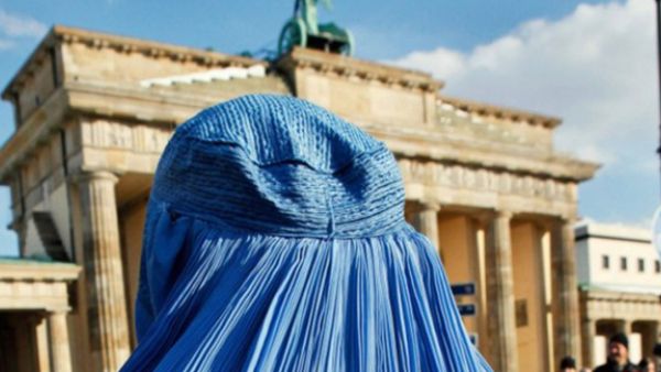 A woman wearing a burka during a demonstration against the German Bundeswehr army's deployment in Afghanistan in front of the Brandenburg Gate in Berlin on February 20, 2010. (AFP/David Gannon)