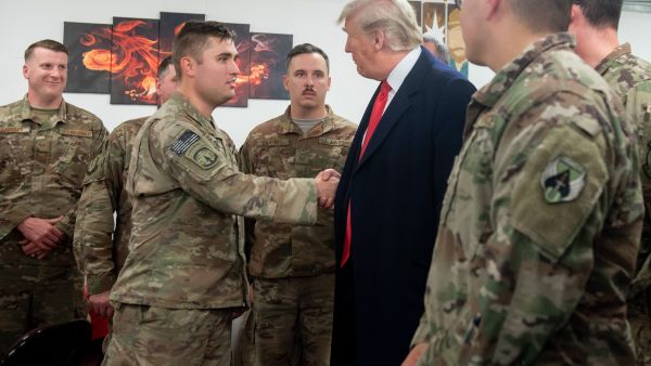 US President Donald Trump greets members of the US military during an unannounced trip to Al Asad Air Base in Iraq. (AFP/ File Photo)