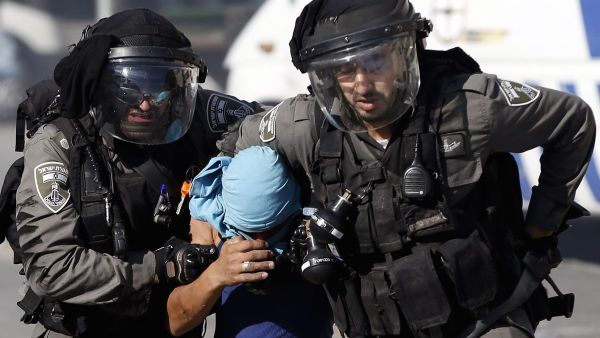 Israeli police arrest a Palestinian during clashes in Shuafat, an east Jerusalem refugee camp. (Ahmad Gharabli/AFP)