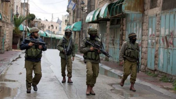 Israeli forces are seen on patrol in Hebron. (AFP/File)