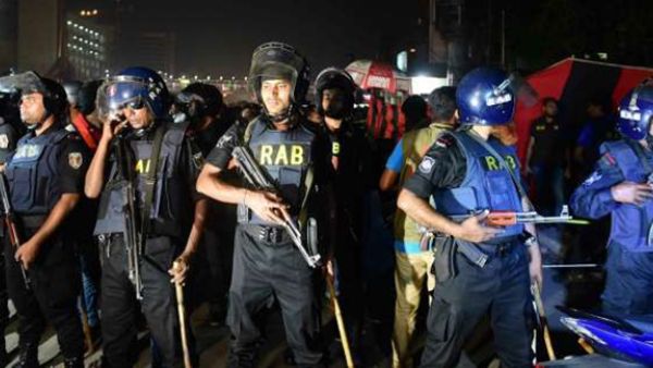 Bangladesh police inspect the crime scene as an attacker was killed in front of a police box at the entrance to Dhaka’s international airport on March 24, 2017. (AFP)