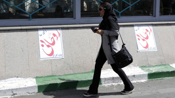 Internal alliances and predictions of tactical political moves from the candidates speak in favour of a win for Rouhani. (AFP) 