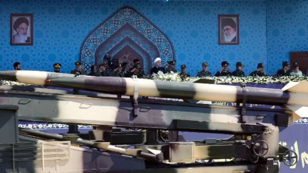 A missile is paraded in front of Iran's President Hassan Rouhani last month (AFP)