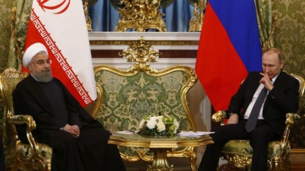 Russian President Vladimir Putin (R) meets with his Iranian counterpart Hassan Rouhani at the Kremlin in Moscow on March 28, 2017. (AFP/Sergei Karpukhin)