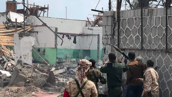 Yemeni men and security forces inspect the site of a suicide bombing in the southern port city of Aden, on November 5, 2017. (AFP/File)