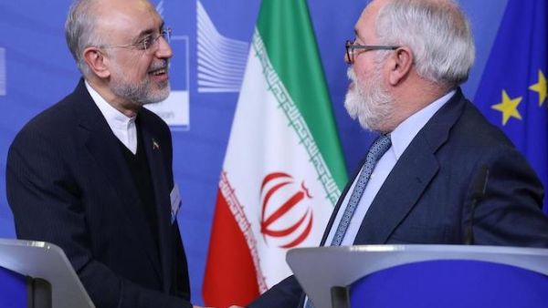 Miguel Arias Canete (R), Commissioner of the European Commission in charge of Climate Action and Energy, and Vice-President of the Islamic Republic of Iran and Head of the Atomic Energy Organisation of Iran (AEOI), Ali Akbar Salehi shake hands during a joint press point in Brussels on November 26, 2018. AFP