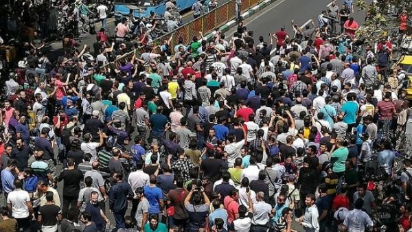 Iranian protesters shout slogans during a demonstration in central Tehran on June 25, 2018. (AFP)