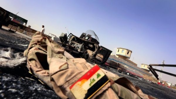 A jacket belonging to an Iraqi soldier lies on the ground ten kilometers from Mosul. (AFP/File)