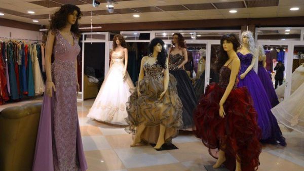 Evening wear and wedding dresses are displayed in a showroom in Mosul, Iraq. (AFP/ File Photo)