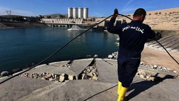 An employee works on Mosul dam. (AFP/ File)