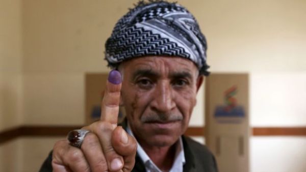 An Iraqi Kurdish man shows his ink-stained finger after voting in the Kurdish independence referendum in Arbil. (AFP/ File Photo)