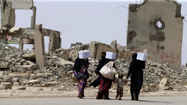 Mosul residents flee fighting earlier this year as government forces battled to retake the city from ISIS (AFP)