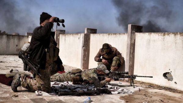 A sniper fires at targets during clashes with ISIS fighters in Mosul. (AFP/ File Photo)