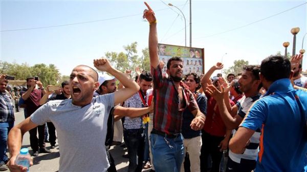 Iraqi protesters shout slogans during a demonstration in the southern city of Basra. (AFP/ File Photo)