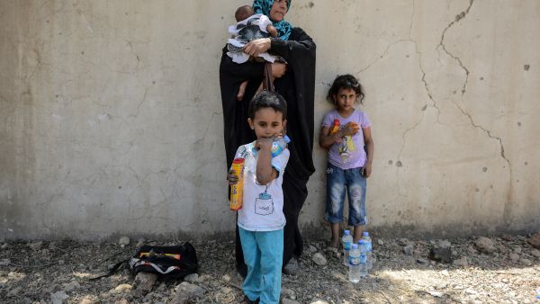 Iraqis displaced from Mosul at a nearby refugee camp (AFP)