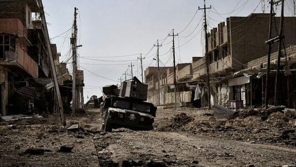 Iraqi special forces drive through a heavily damaged street in Mosul, on March 1, 2017. (AFP)