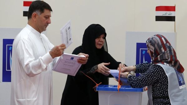 Iraqi nationals residing in the UAE cast their ballots for Iraq’s parliamentary elections at a polling station in Dubai.(Karim Sahib / AFP File Photo)