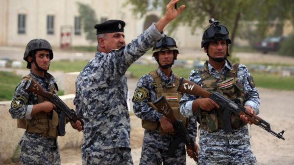 Iraqi policemen are seen on patrol inside a military base in Baghdad, on June 11, 2014, after the declaration of a state of emergency by the government. (AFP/Ahmad al-Rubaye)