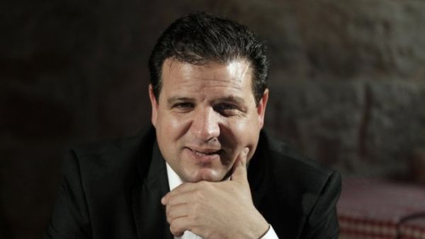 The death threats came after three MKs including, Ayman Odeh, pictured, were temporarily suspended from Knesset for visiting Palestinian families killed while attacking Israelis. (AFP/Ahmad Gharabli)