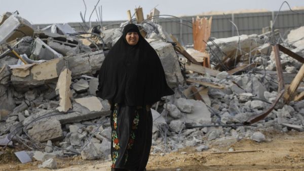 A Bedouin woman cries following the destruction of houses on January 18, 2017 in Umm al-Hiran (Menahem Kahana/AFP)