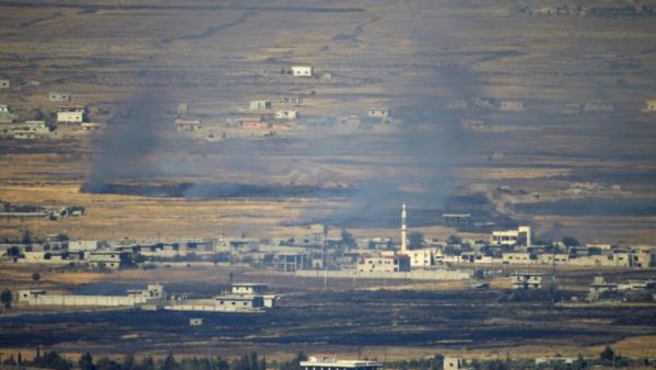 A picture taken from the Israeli-occupied Golan Heights shows smoke billowing from the Syrian side of the border on June 24, 2017, after projectiles fired from the war-torn country hit the Golan. (Jalaa Marey/AFP)