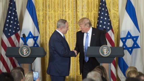 Trump and Netanyahu shake hands at recent press conference [Byline / Source / Credit
Saul Loeb / AFP]