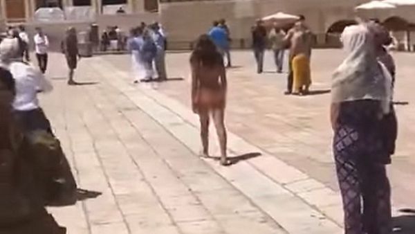A naked woman at Jerusalem's Western Wall on Sunday (screenshot: Youtube)