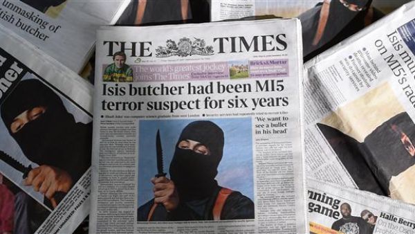A file picture taken on February 27, 2015, shows an arrangement of British daily newspapers photographed in London showing the front-page headlines and stories regarding the identification of the masked ISIL militant dubbed "Jihadi John". AFP Photo